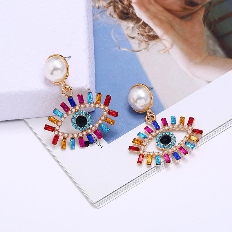 fashion exaggerated devil's eye pearl alloy inlaid colored diamonds earrings