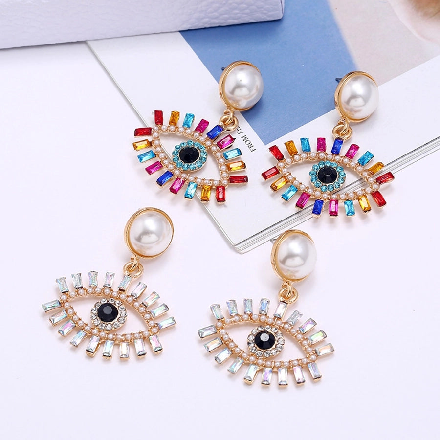 fashion exaggerated devil's eye pearl alloy inlaid colored diamonds earrings